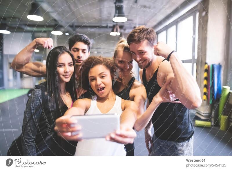 Group of young people posing for a selfie in gym athlete sportswoman athletes female athlete sportswomen female athletes friends Sportspeople Sportsman