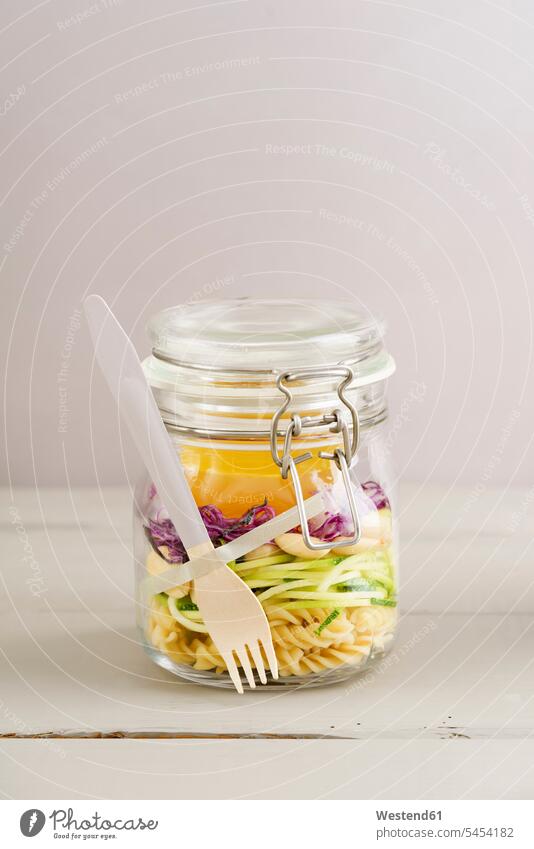 Preserving jarr of vegan mixed salad with pasta Glass Glasses spice flavouring flavoring spices Salad Salads wooden Vegetable Vegetables Fork Forks