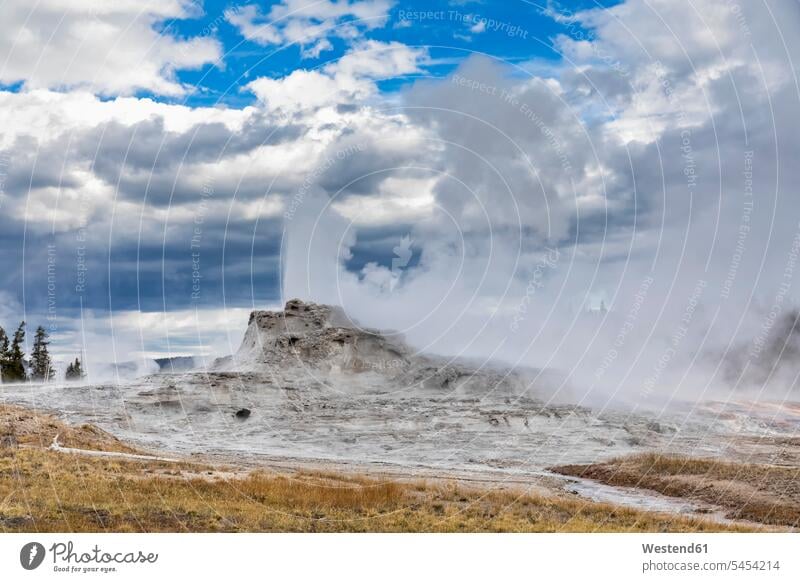 USA, Wyoming, Yellowstone National Park, Upper Geyser Basin, Castle Geyser erupting cloud clouds eruption eruptions dramatic steam outdoors outdoor shots