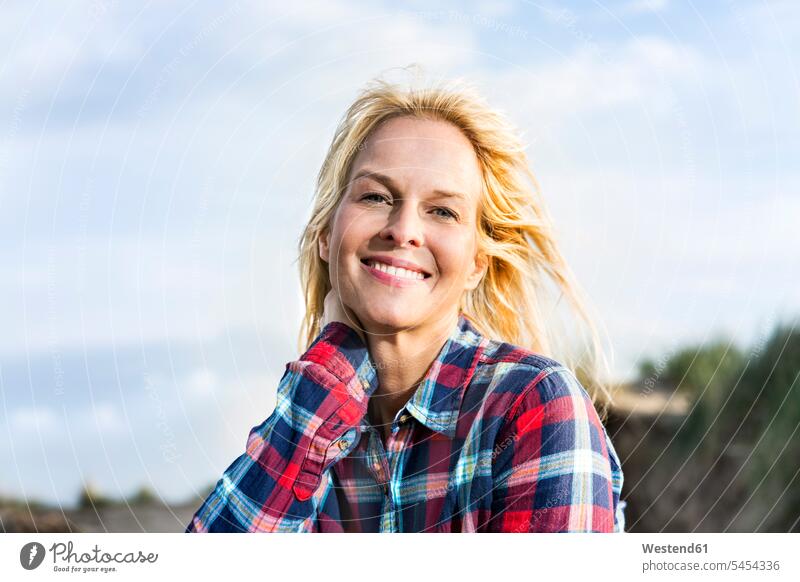 Portrait of smiling woman in dunes portrait portraits females women sand dune sand dunes smile Adults grown-ups grownups adult people persons human being humans