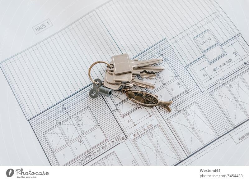 Bunch of keys on a construction plan building plan architectural drawing flat flats apartment apartments property floor plan floor plans ground plan
