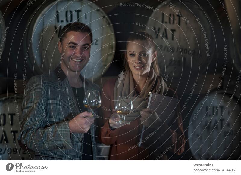 Portrait of smiling man and woman tasting wine smile Wine Wine Tasting wine-tasting winetasting Alcohol alcoholic beverage Alcoholic Drink Alcoholic Drinks