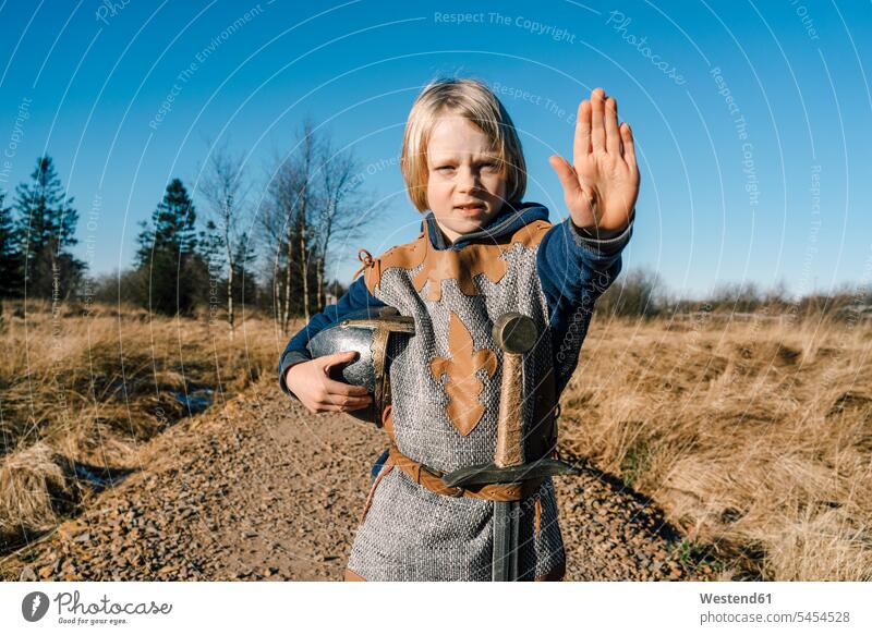 Portrait of little boy wearing knight costume in nature knights boys males portrait portraits symbol symbols child children kid kids people persons human being