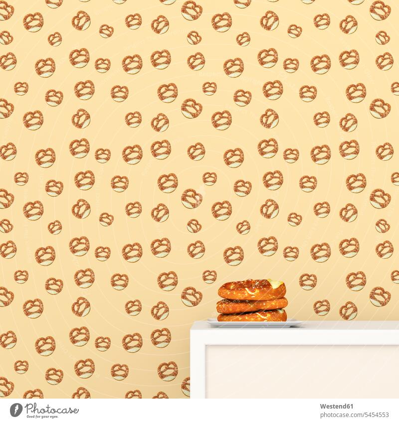 Plate with pretzels on cup board in front of wallpaper with pretzel pattern, 3D Rendering patterned structure structures on top of Part Of partial view cropped