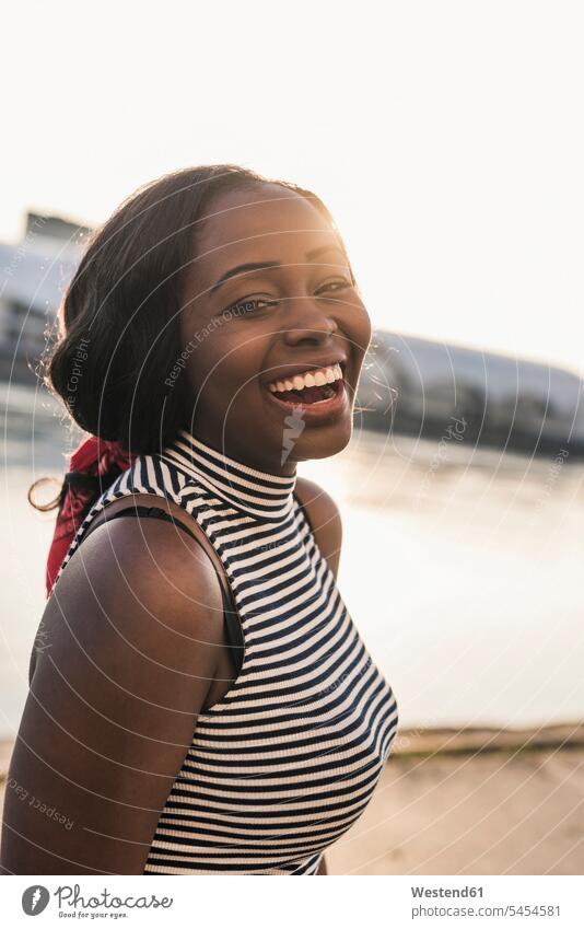 Portrait of a laughing young woman Fun having fun funny portrait portraits females women happiness happy cheerful gaiety Joyous glad Cheerfulness exhilaration