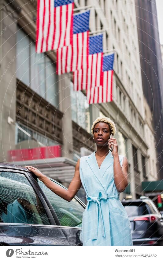 USA, New York, young blonde african-american woman using smartphone use Smartphone iPhone Smartphones females women mobile phone mobiles mobile phones Cellphone