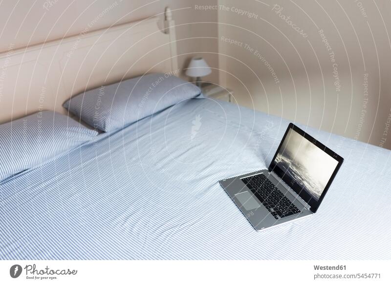 Laptop on a bed home at home bedroom Domestic Bedroom beds laptop Laptop Computers laptops notebook rooms domestic room domestic rooms computer computers