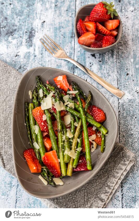 Salad of green asparagus, strawberries and parmesan food and drink Nutrition Alimentation Food and Drinks wooden Salads rich in vitamines ready to eat