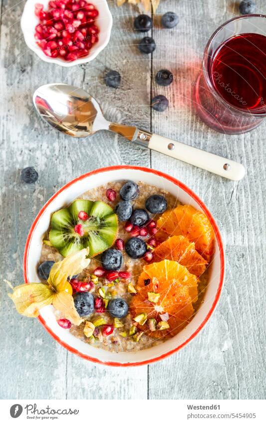 Superfood breakfast with porridge, amaranth, various fruits and pistachios food and drink Nutrition Alimentation Food and Drinks superfood blueberry bilberry