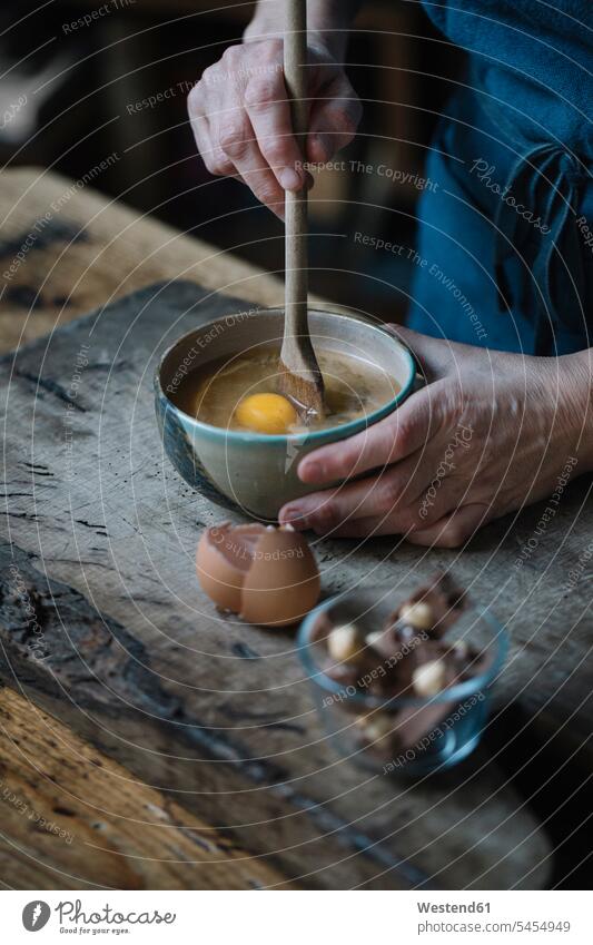 Woman preparing dessert, partial view hand human hand hands human hands Food Preparation preparing food stirring people persons human being humans human beings
