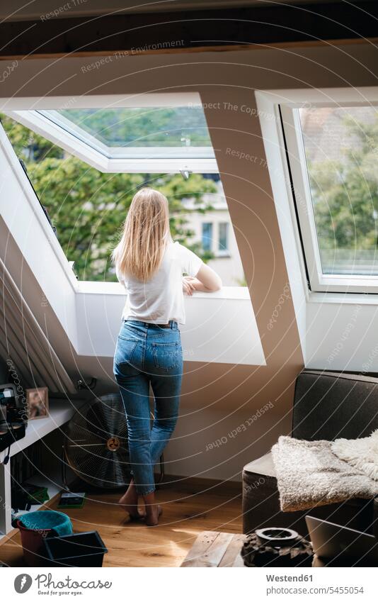 Young woman looking out of window Looking Through Window Looking Through A Window looking through glass home at home windows blond blond hair blonde hair