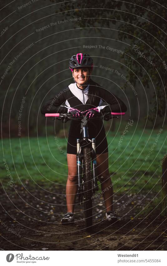 Portrait of smiling woman with mountain bike mountain biking MTB mountainbiking smile females women cycling sport sports bicycle bikes bicycles Adults grown-ups