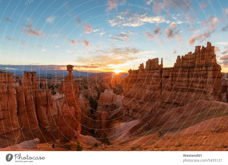 USA, Utah, Bryce Canyon National Park, Thors Hammer and other hoodoos in amphitheater at sunrise as seen from Navajo Loop Trail sunlight Sunlit sun rise