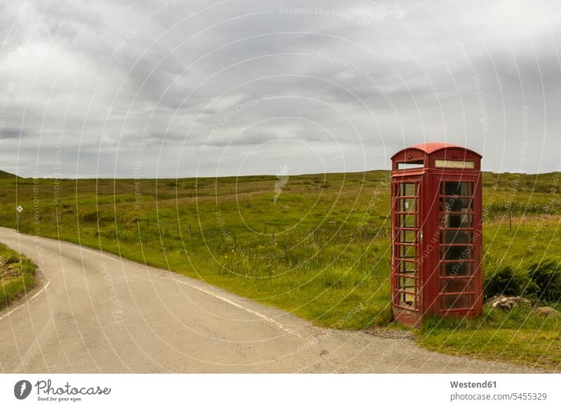 UK, Scotland, Isle of Skye, red old telephone booth at roadside past The Past Road Side Solitude seclusion Solitariness solitary remote secluded copy space