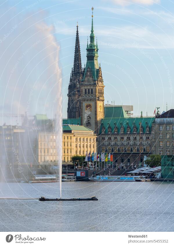 Germany, Hamburg, city hall and St Nikolai Memorial with Inner Alster and Alster fountain in the foreground copy space Architecture city center downtown
