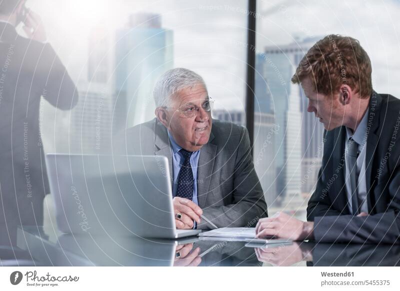 Businessmen with laptop discussing in office talking speaking Business Meeting business conference meeting Businessman Business man Business men offices