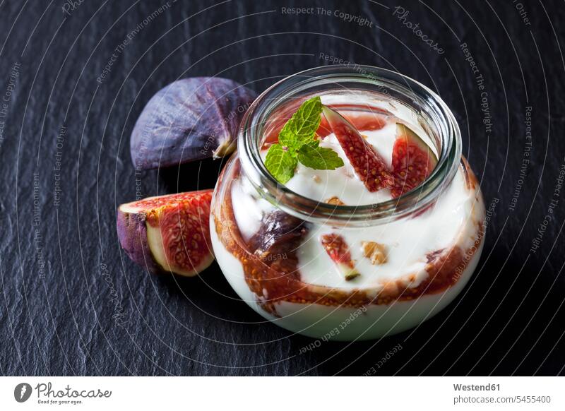 Glass of Mascarpone cream with fig compote and walnuts on slate food and drink Nutrition Alimentation Food and Drinks Glasses prepared ready to eat ready-to-eat