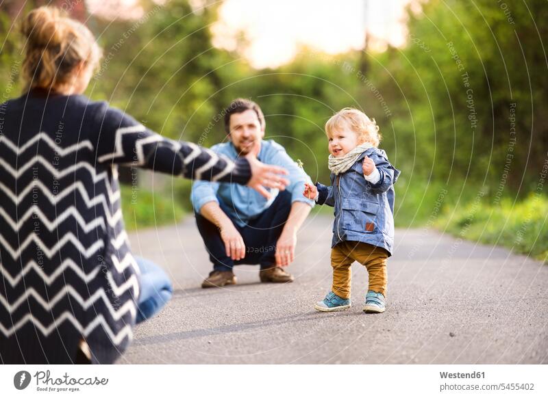 Cute little boy with parents on field path baby infants nurselings babies family families people persons human being humans human beings portrait portraits