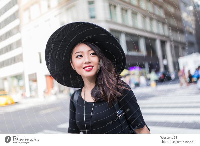 USA, New York City, Manhattan, portrait of fashionable young woman wearing black hat hats females women portraits Adults grown-ups grownups adult people persons
