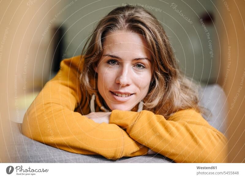 Portrait of young woman relaxing at home portrait portraits females women smiling smile relaxed relaxation Adults grown-ups grownups adult people persons