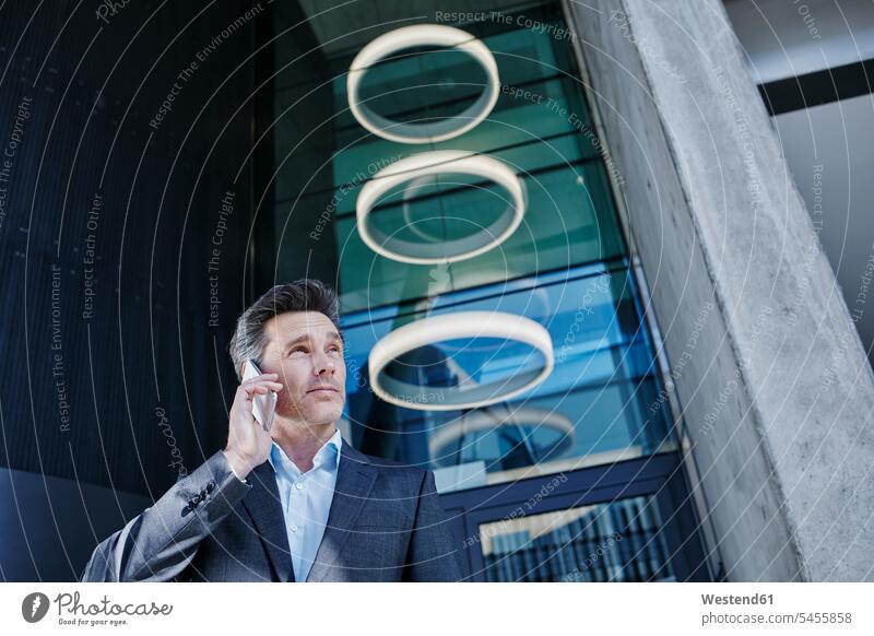 Portrait of businessman on the phone Businessman Business man Businessmen Business men Smartphone iPhone Smartphones portrait portraits call telephoning