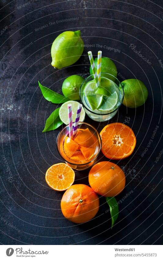 Limes and tangerines on dark background overhead view from above top view Overhead Overhead Shot View From Above Tangerine Citrus reticulata Tangerines