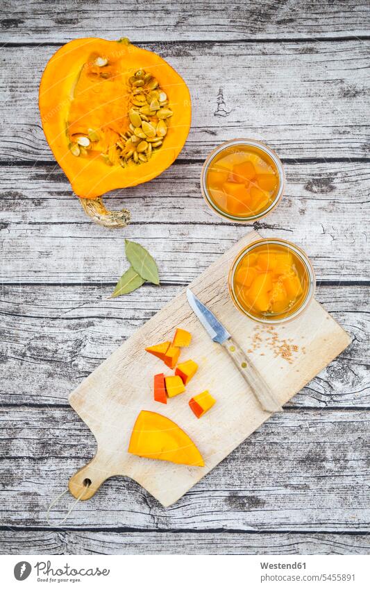 Two glasses of sweet-and-sour pickled pumpkin and ingredients on wood food and drink Nutrition Alimentation Food and Drinks sliced uncooked raw preserving