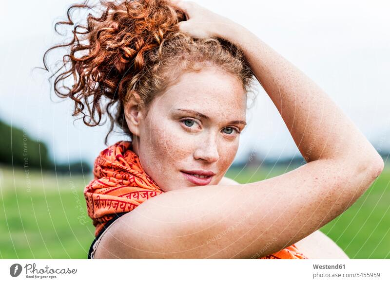 Portrait of freckled young woman with curly red hair Smartphone iPhone Smartphones females women curly hair curls portrait portraits mobile phone mobiles