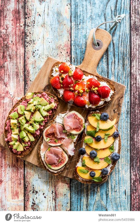 Various sandwiches, strawberry, fig, nectarine, avocado, on chopping board food and drink Nutrition Alimentation Food and Drinks variation nectarines Variety