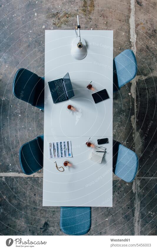 Conference table seen from above, turkish tea, prayer beads, tablet, smartphone, laptop and notebook Globalisation Globalization worldwide globalizing