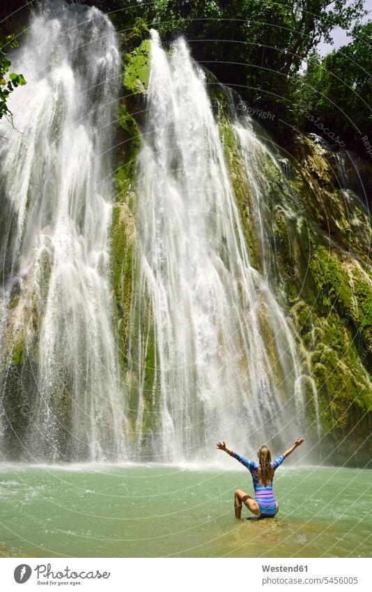 Dominican Republic, Samana, woman admiring huge waterfall happiness happy females women waterfalls Adults grown-ups grownups adult people persons human being