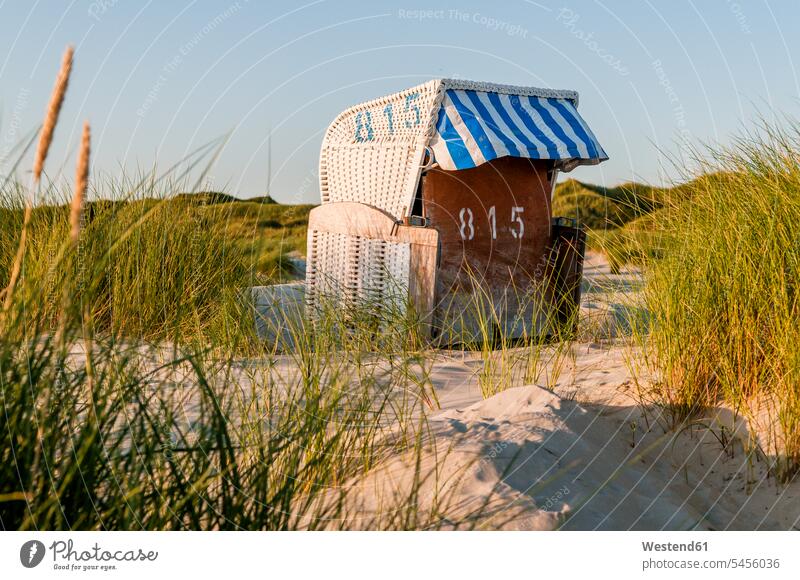 Germany, Amrum, locked hooded beach chair in dunes journey travelling Journeys voyage sandy beach sandy beaches Travel destination Destination