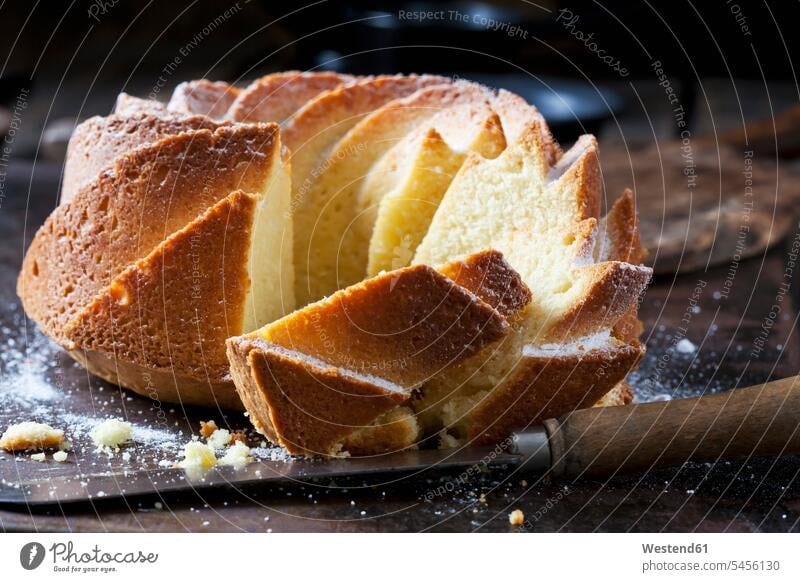 Sliced Gugelhupf sprinkled with icing sugar nobody copy space prepared baked Baked Food Ring Cake Bundt Cake Ring Cakes Bundt Cakes sweet Sugary sweets