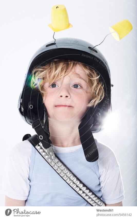 Portrait of a boy dressed up as spaceman boys males helmet helmets Protective Headwear astronaut astronauts playing child children kid kids people persons