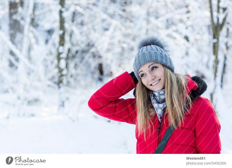Portrait of smiling young woman in snow-covered nature females women portrait portraits Adults grown-ups grownups adult people persons human being humans