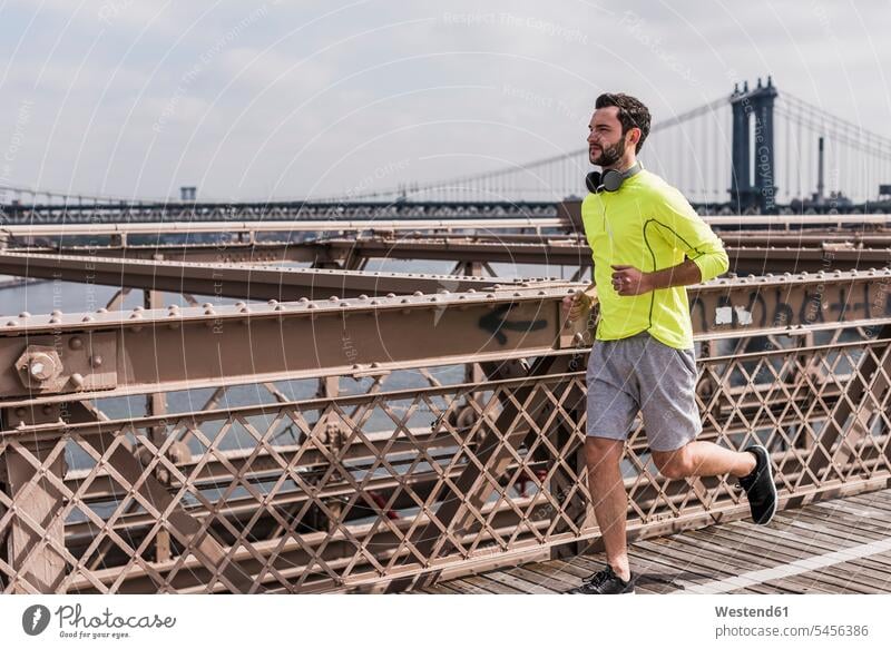 USA, New York City, man running on Brooklyn Brige bridge bridges Jogging men males fitness sport sports Adults grown-ups grownups adult people persons