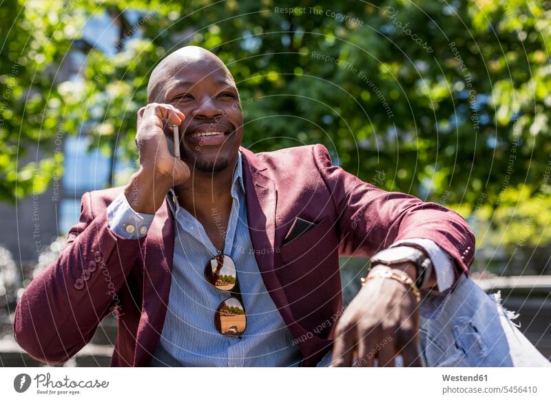 Portrait of smiling businessman on the phone Businessman Business man Businessmen Business men Smartphone iPhone Smartphones call telephoning On The Telephone