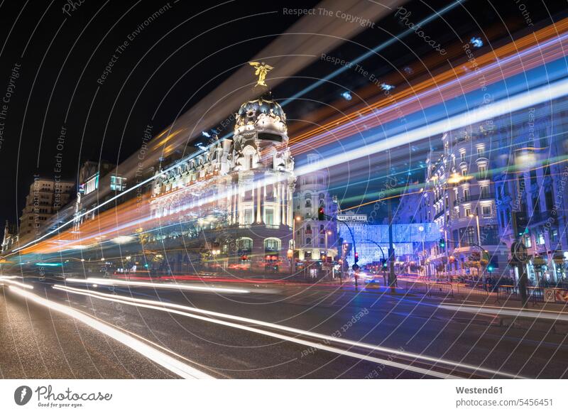 Spain, Madrid, Gran Via street with rays of traffic light by night illuminated lit lighted Illuminating illumination illuminations Long Exposure Time Exposed