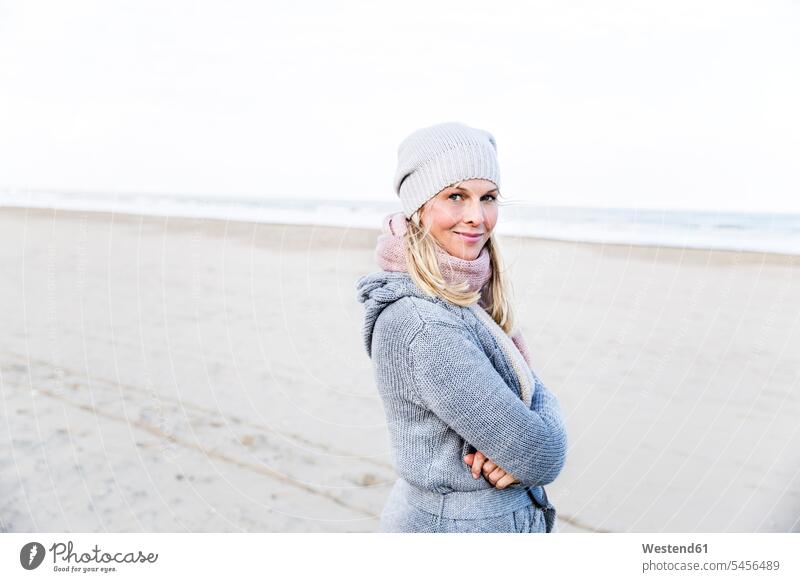 Portrait of smiling woman on the beach beaches portrait portraits females women smile Adults grown-ups grownups adult people persons human being humans