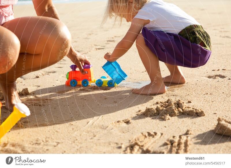 Spain, Fuerteventura, mother and daughter playing on the beach beaches happiness happy vacation Holidays Travel quality of life Quality Time nature