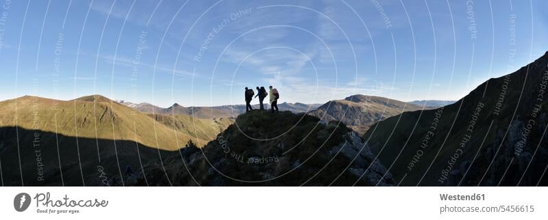 UK, North Wales, Snowdonia, Nantlle Ridge, silhouette of three mountaineers climber alpinists climbers Mountain Climber Mountain Climbers mountains