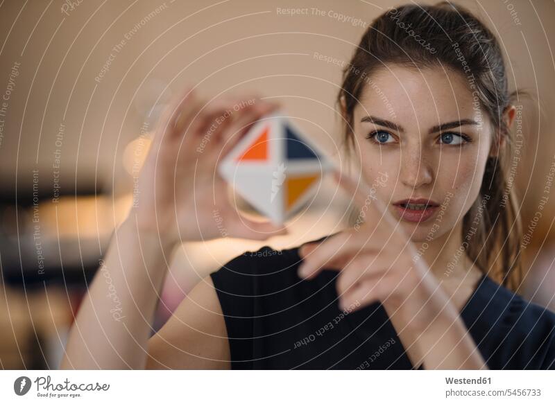 Portrait of young woman organising time management with cube human human being human beings humans person persons caucasian appearance caucasian ethnicity