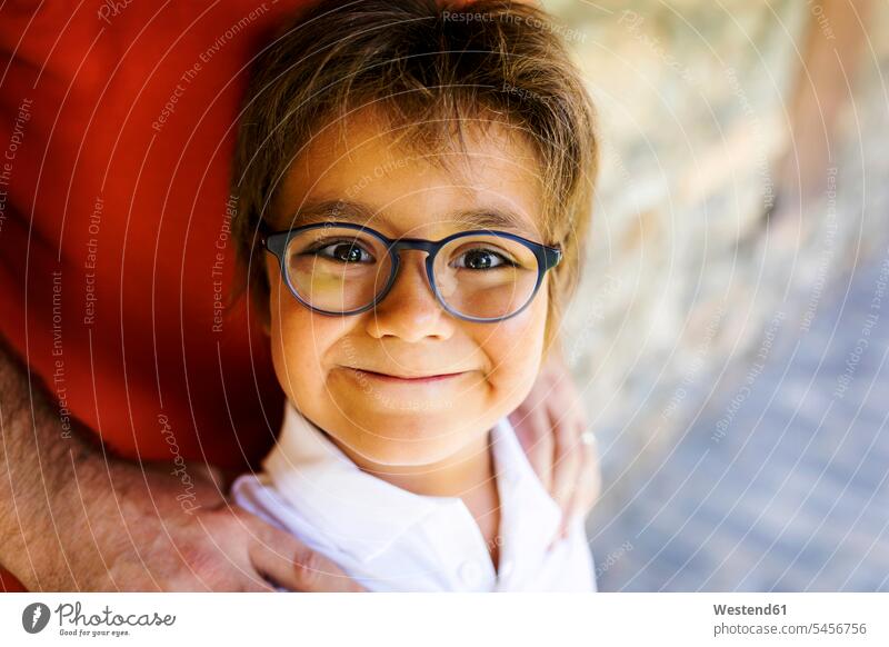 Portrait of smiling little boy wearing glasses specs Eye Glasses spectacles Eyeglasses smile boys males portrait portraits child children kid kids people