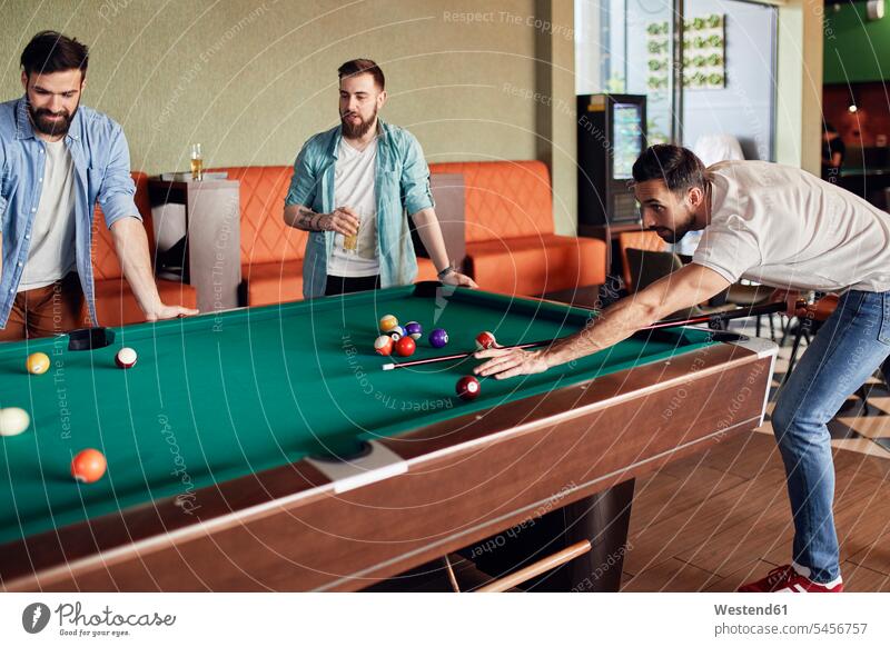 Friends playing billiards together friends mate game games friendship billards cue billards cues Bending Over Concentration concentrating concentrated