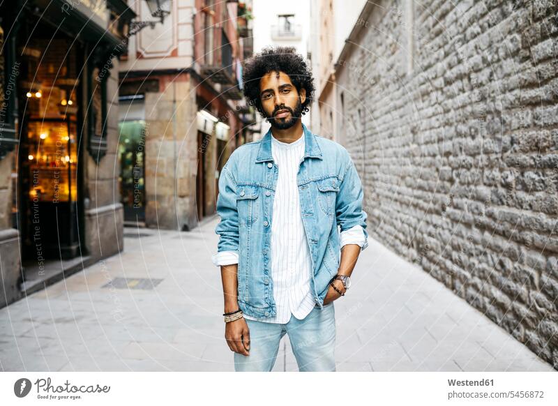 Spain, Barcelona, portrait of bearded young man with curly hair portraits curls men males hairstyle hair-dos hairstyles hairdos people persons human being