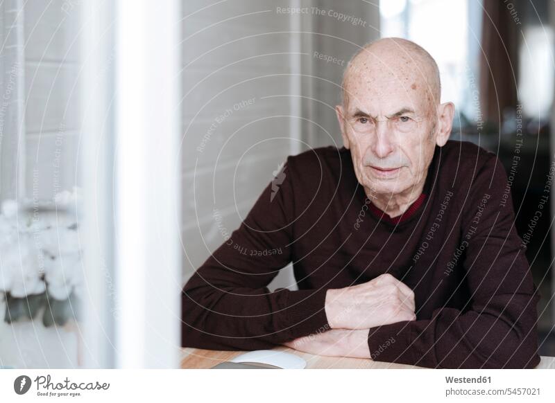 Portrait of pensive old man sitting at table looking out of window human human being human beings humans person persons caucasian appearance caucasian ethnicity