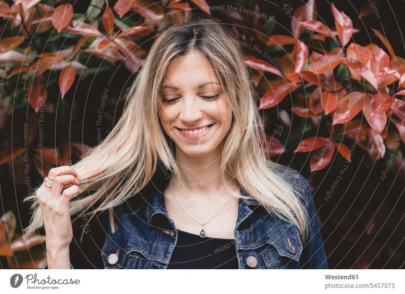 Portrait of happy young woman in autumn fall portrait portraits females women happiness Adults grown-ups grownups adult people persons human being humans
