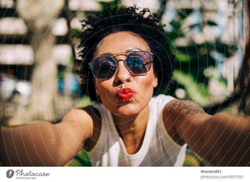 Close-up of stylish woman wearing sunglasses puckering lips color image colour image Portugal leisure activity leisure activities free time leisure time