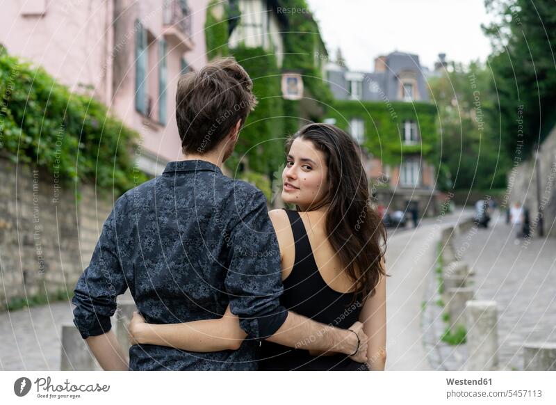 France, Paris, young couple in an alley in the district Montmartre lane Laneway twosomes partnership couples Ile-de-France path trail paths people persons