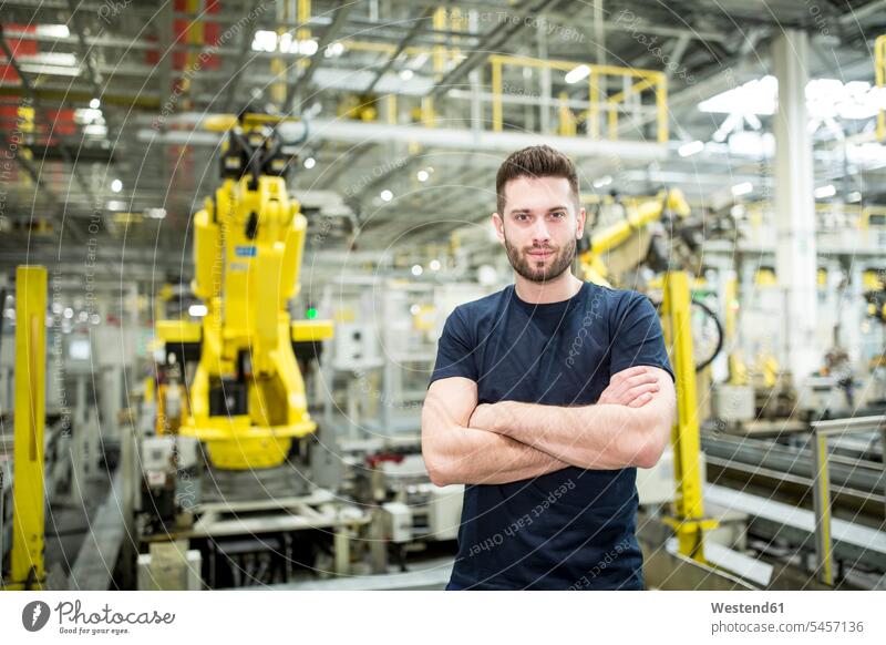 Portrait of confident worker in a modern factory Occupation Work job jobs profession professional occupation blue collar blue collar worker blue-collar worker